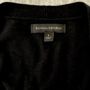 Banana Republic black v-necked cardigan sweater with side slits.